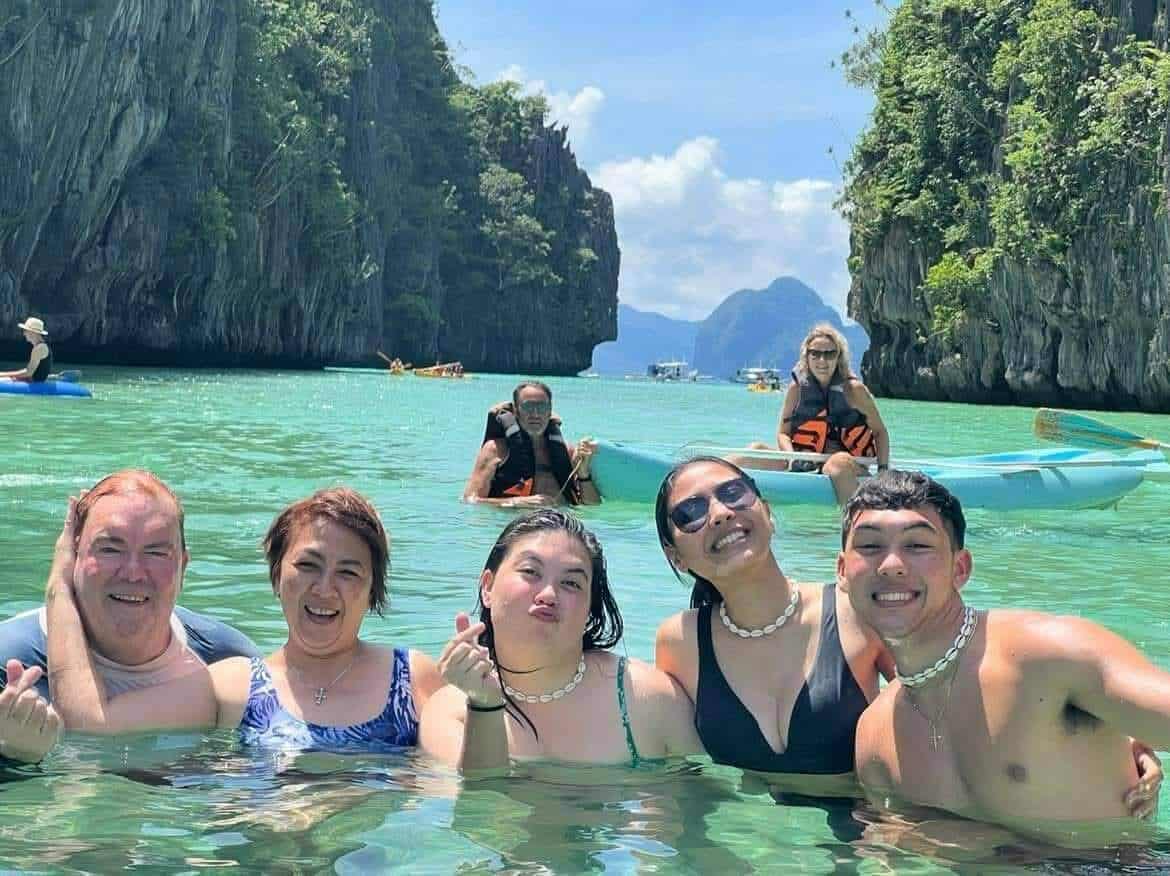 Limestone cliffs and calm lagoon water in El Nido