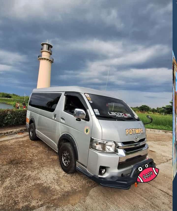 Silver Toyota Hiace at the lighthouse — the exterior of your private transfer van