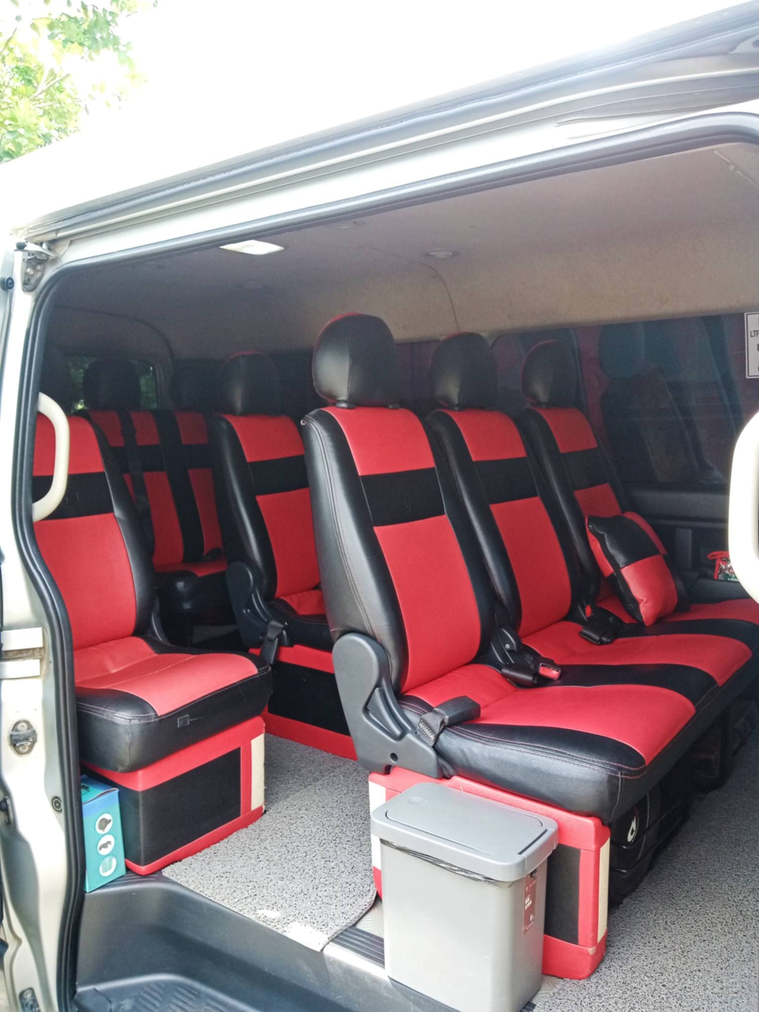 Red and black premium van interior with spacious seats for travelers