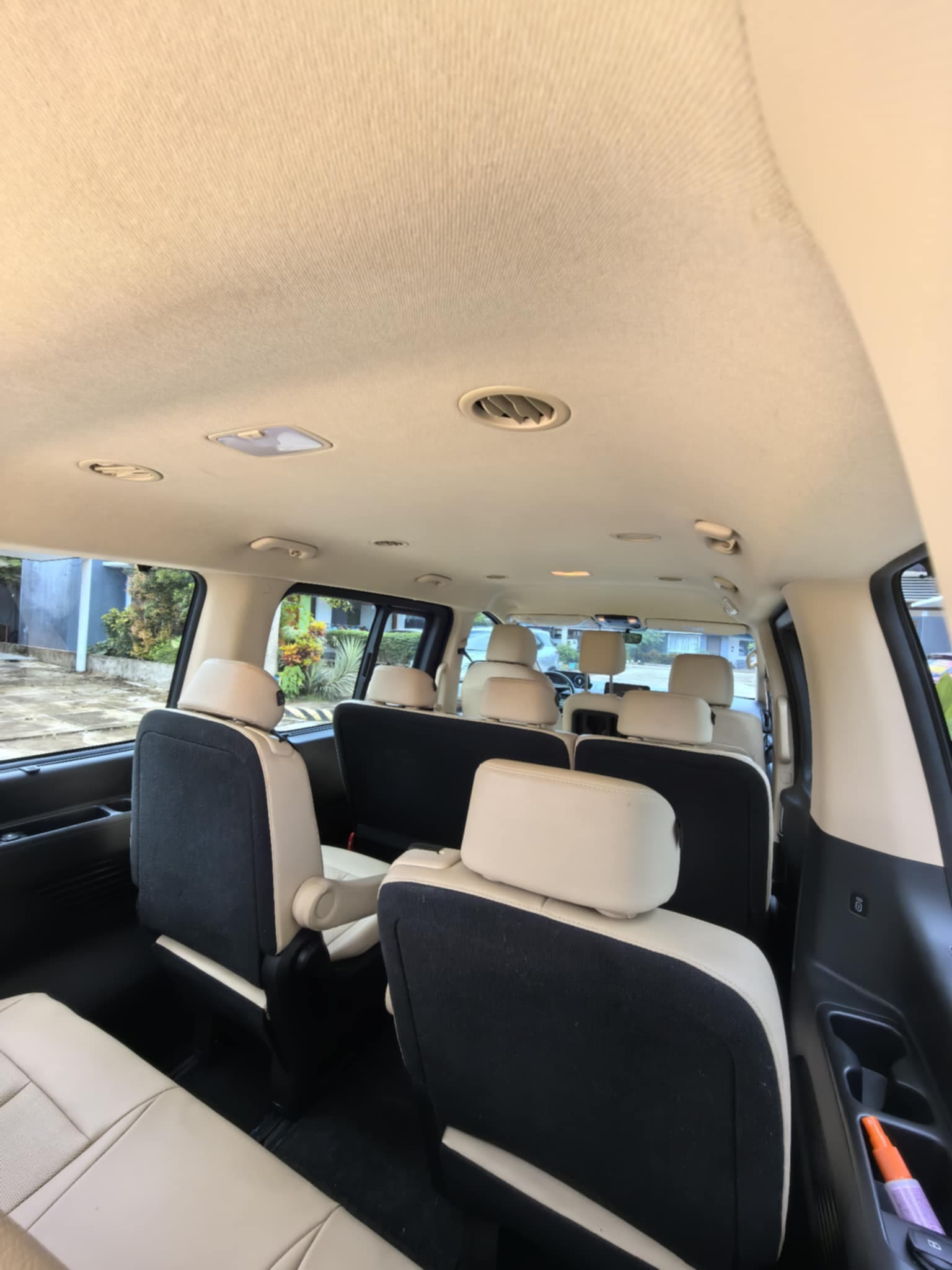 Luxury van with driver Palawan - spacious 11-passenger cabin Underground River tour interior