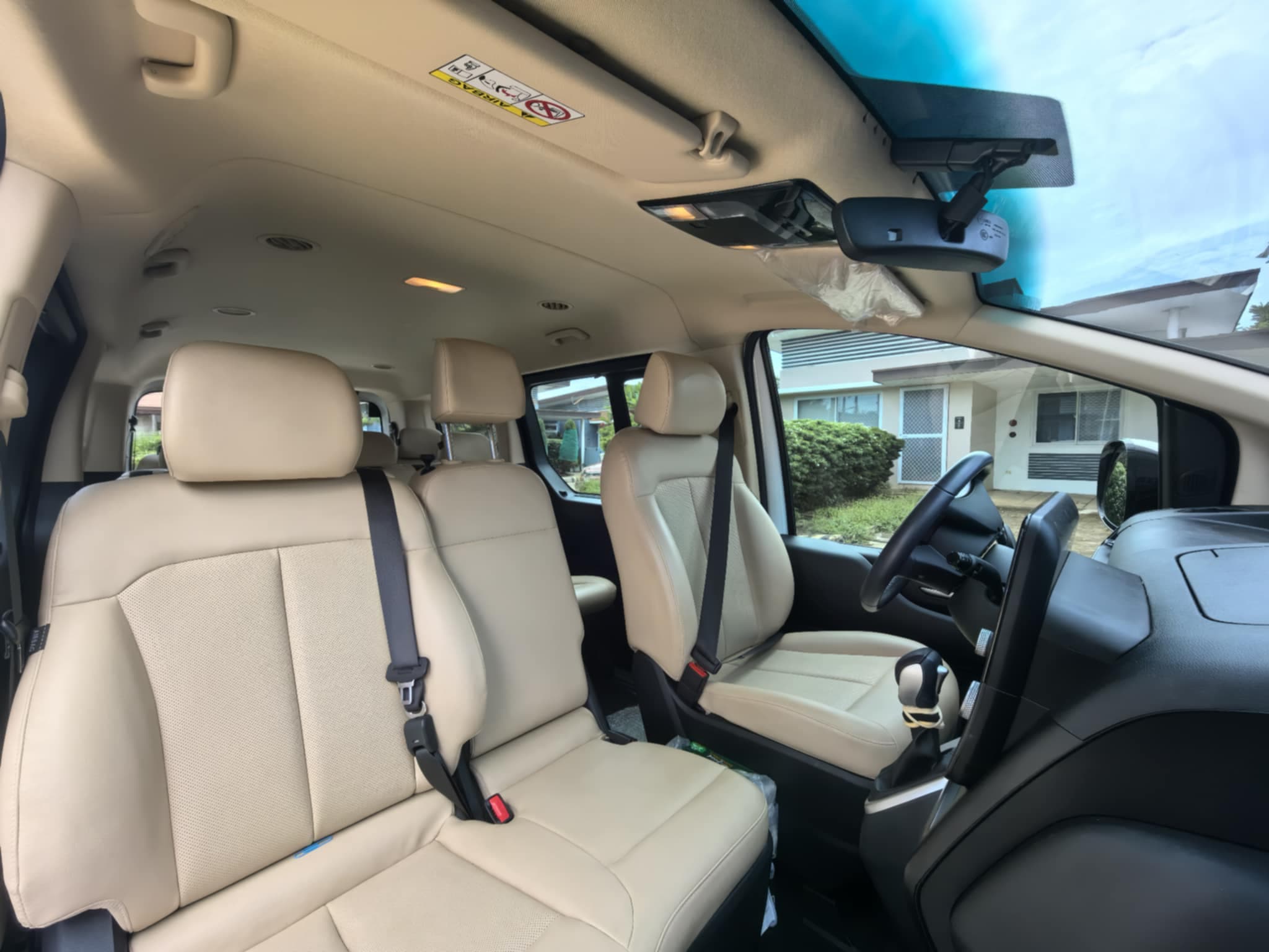 Hyundai Staria front passenger area — beige leather with steering wheel